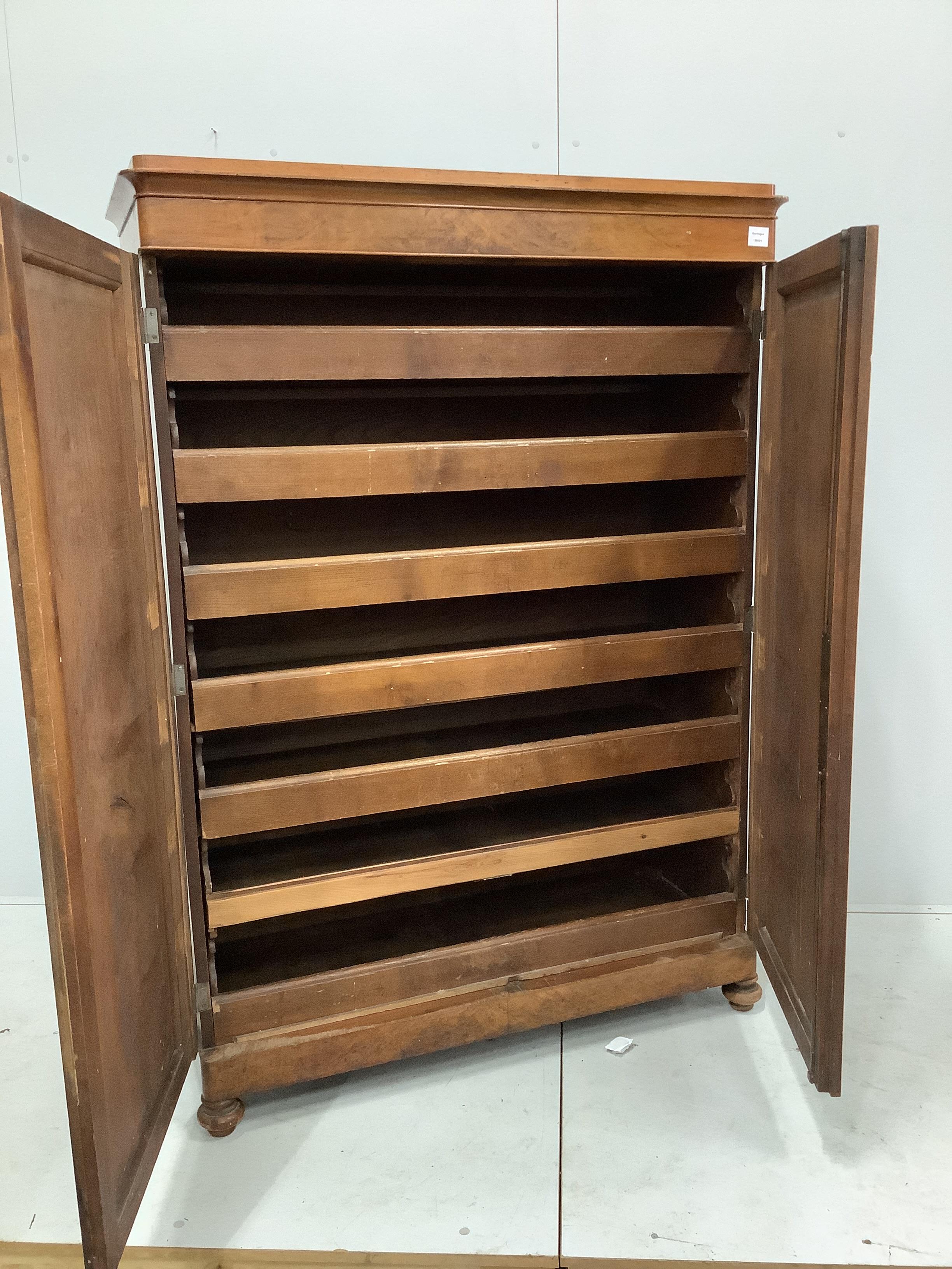A 19th century French mahogany press cupboard, width 112cm, depth 46cm, height 158cm